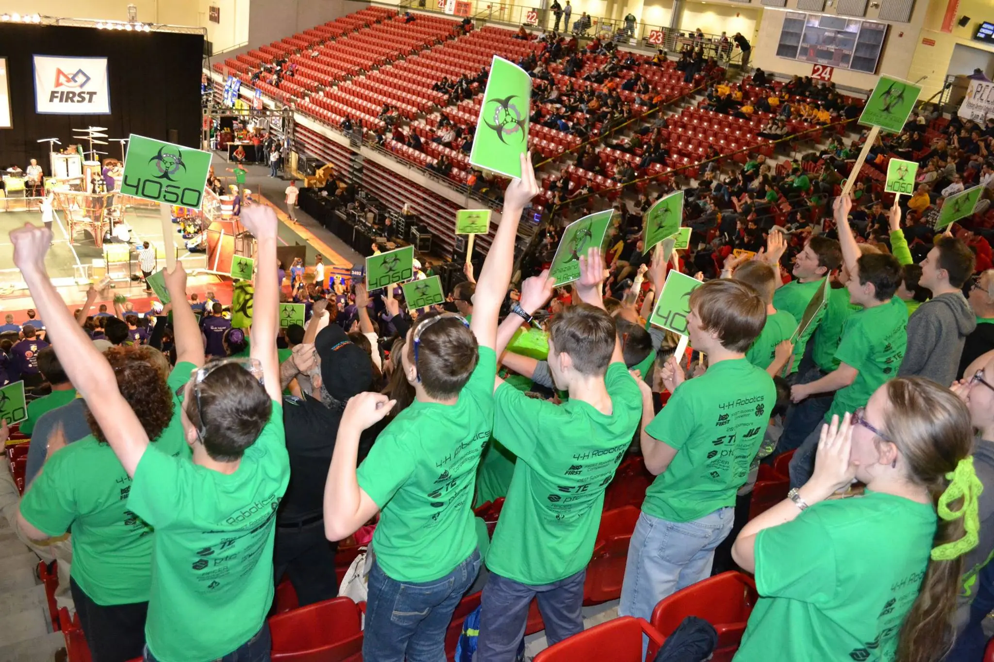 Team members cheering at competition