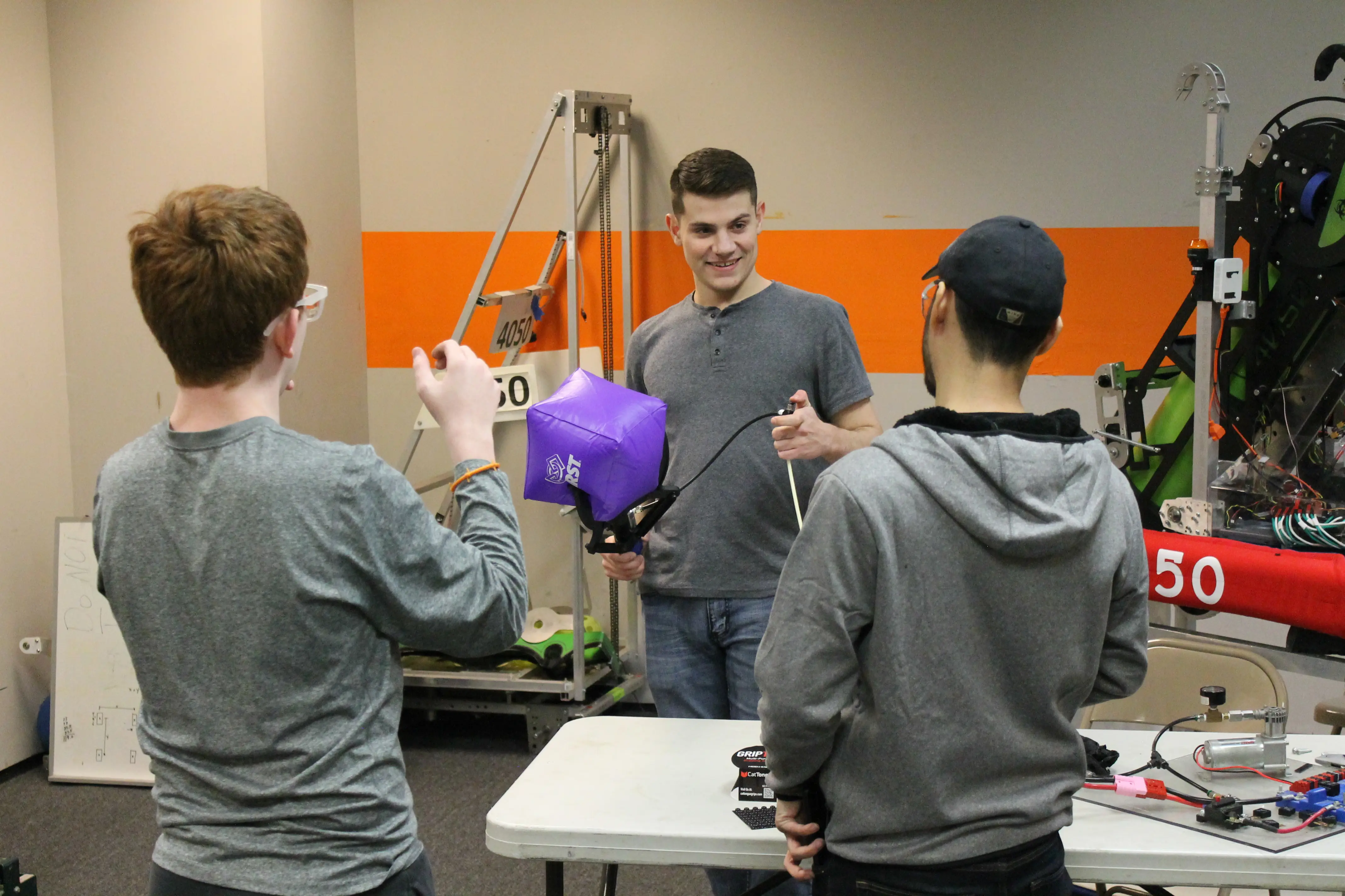 A student and mentor get hands-on with a robot